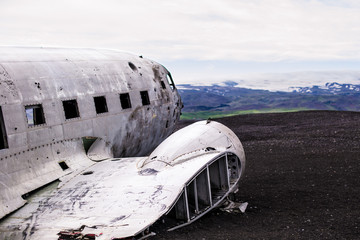 Airplane wreckage on black sand beach. Iceland