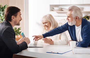 Finance advisor meeting with elderly couple of clients
