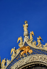 Fototapeta na wymiar Saint Mark Basilica in Venice shines like gold at the sunset (with copy space)