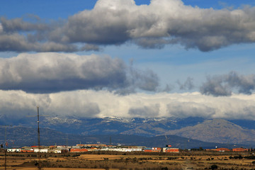 Landscape, cloudy sky and mountains