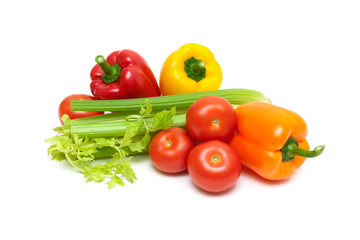Sweet pepper, celery and tomatoes on a white background