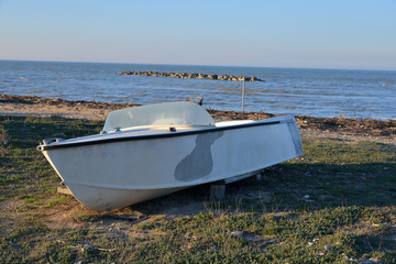 isolated wooden boat on the beach