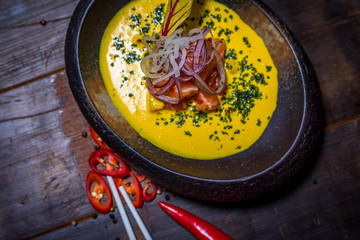 Asian yellow soup top view
