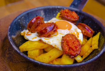 Spanish chorizo with fried egg and potatoes