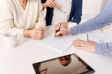 Gifted real estate agent demonstrating house project to the clients
