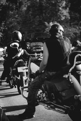 Fototapeta na wymiar A biker on a motorcycle in line waiting for the train.