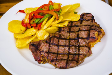 Grilled garnished veal steak 