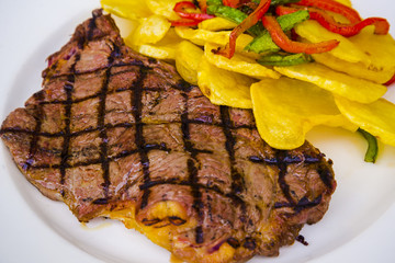 Grilled garnished veal steak 