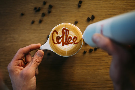 Barista Drawing on Coffee 