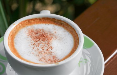 close up coffee cappuccino on wooden balcony