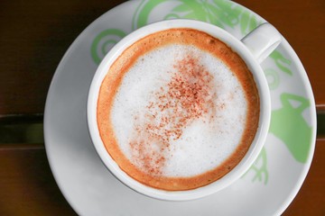 close up coffee cappuccino on the wooden floor background