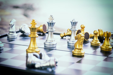 abstract scene of check mate on golden king in chess game - can use to display or montage on product