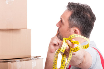 Selective focus of man holding measuring tape