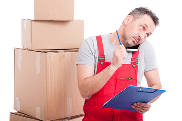 Mover guy multitasking with clipboard and phone
