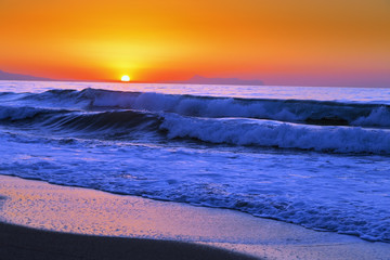 Beautiful sunset in the western part of the island of Crete, near the town of Rethymnon. Seascape. Sunset over the sea.