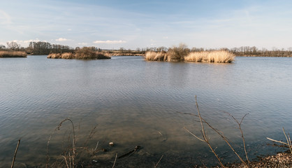 Podhornik pod with small islands and blue sky between Jistebnik and Polanka nad Odrou in CHKO Poodri near Ostrava city in Czech republic during nice early spring day
