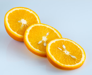 Sliced orange on a light blue background