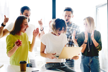 Team of successful freelancers is celebrating the receiving of positive answer from the investors....