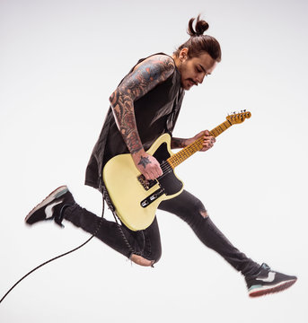 Guitarist plays guitar.