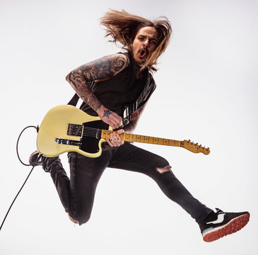 Guitarist plays guitar.