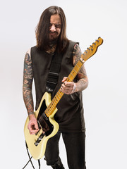 Guitarist plays guitar.