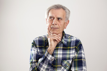 Portrait elderly man on gray background