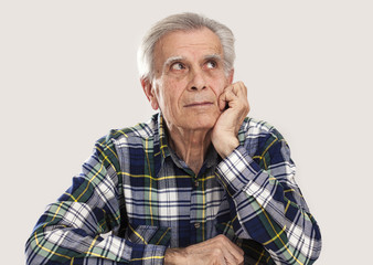 Portrait elderly man on gray background
