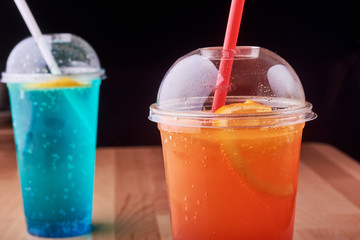 Drink with slice of orange.