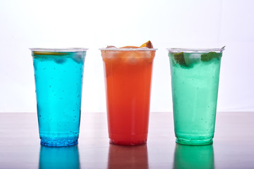 Three colorful beverages.