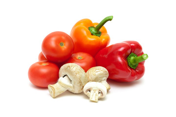 Champignons and vegetables isolated on white background