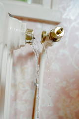 Pipe burst off of a radiator, leaking water