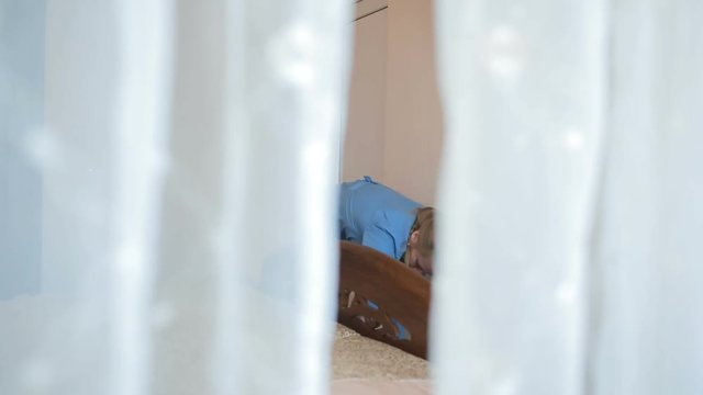 Maid doing cleaning in the bedroom