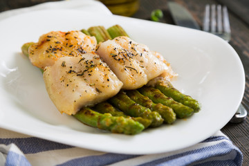 Baked fish with fried asparagus