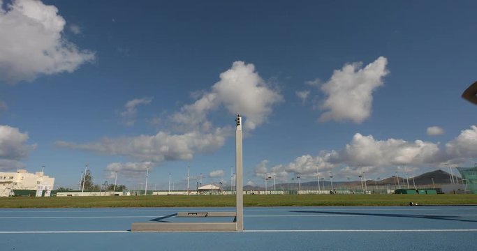 A Hurdler hurdles a hurdle in slow motion.