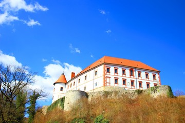 Beautiful castle on the hill, blue sky in background