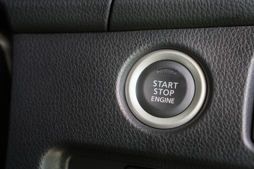 Start stop engine modern new car button ,selective focus..