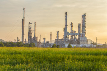 The oil refinery is surrounded by grasslands that to maintain the environment and natural balance.