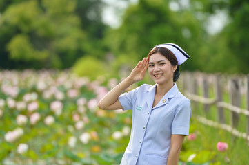 Young nurse portrait,beautiful woman in nurse suit portrait,nurse suit thailand,Asian nurse holding...