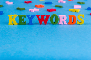 Word keywords from colored wooden letters.