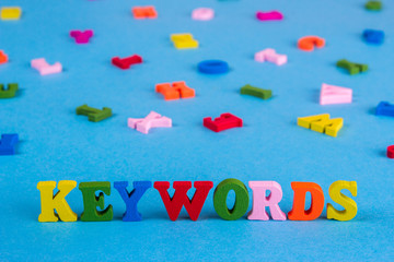 Word keywords from colored wooden letters.