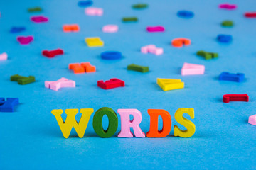 Word words from colored wooden letters.