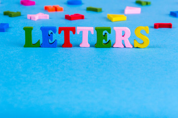 Word Letters made of colored wooden letters