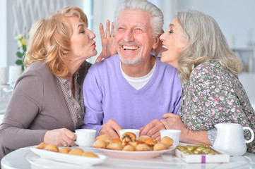 Elderly people having breakfast