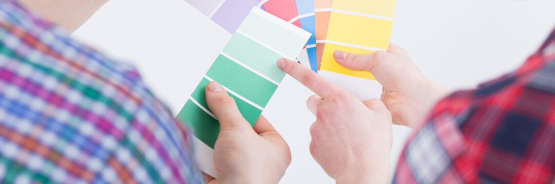 People comparing paint colors