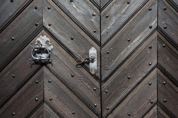 Black wooden door with iron decoration background and texture