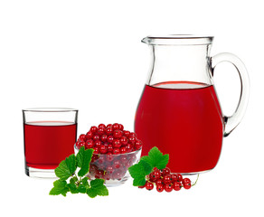 red currant drink in a glass and a decanter with berries currants