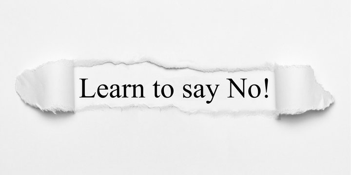 Learn to say No! on white torn paper
