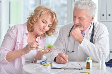 Sick elderly woman in a doctor's office