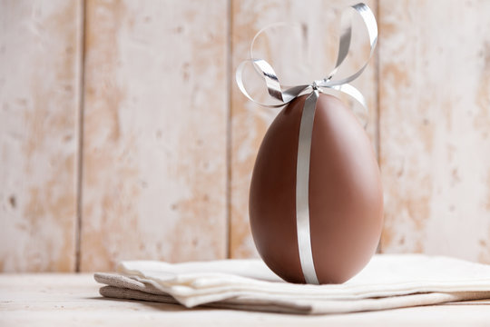 Delicious chocolate Easter egg with a ribbon