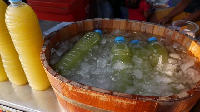 Sugar Cane Fruit Juice in Bottles on Local Thai Market. HD. Phuket, Thailand.